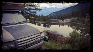 overland camper at unusual dam