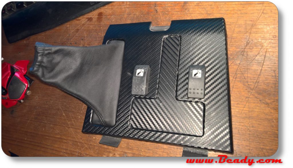 custom switch panel in carbon fibre for range rover