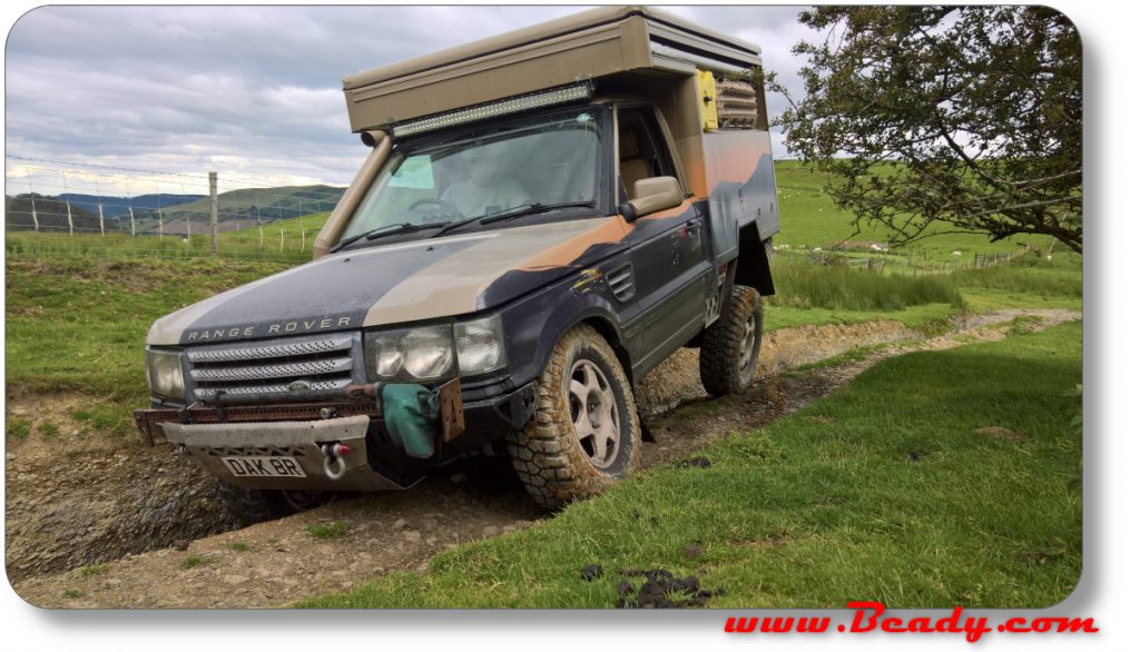 Range rover under extreme cross axle in Wales