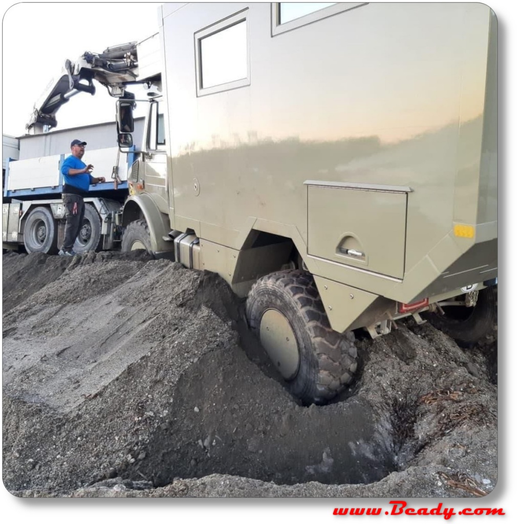 Unimog expedition overland camper recovery from beach