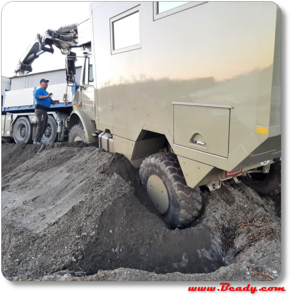 Unimog expedition overland camper recovery from beach, big hiab to recover from sand