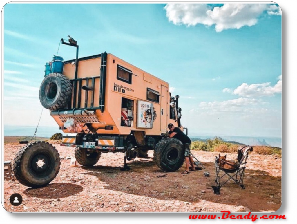 changing a tyre on abig overland camper truck