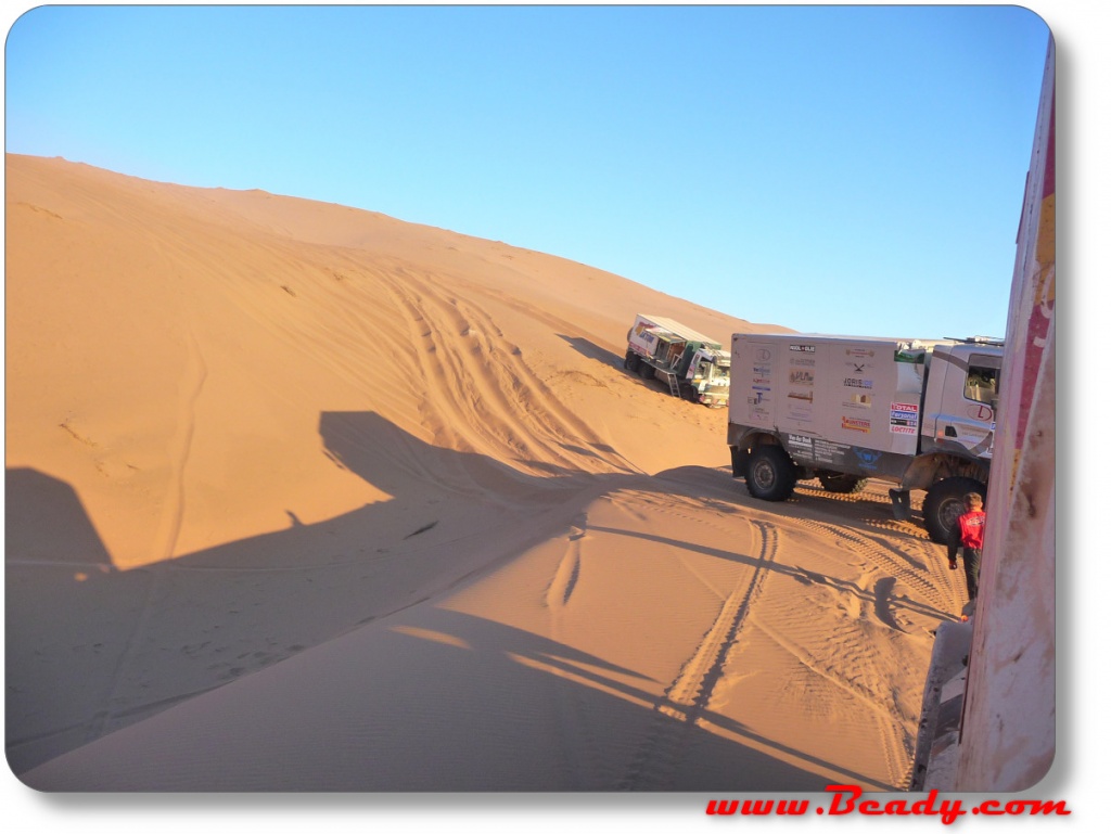 dakar rally race truck stuck in sand