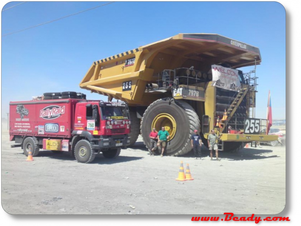 dakar support truck iveco next to massive dump truck