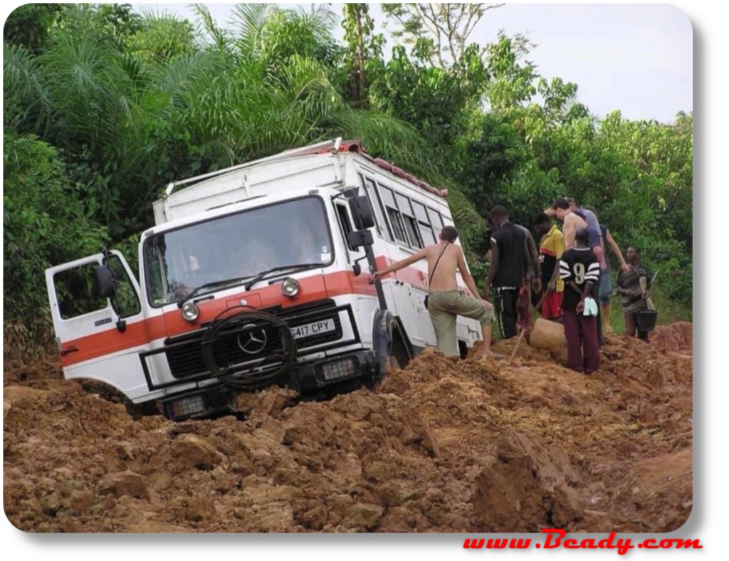 overland truck stuck in mud in africa