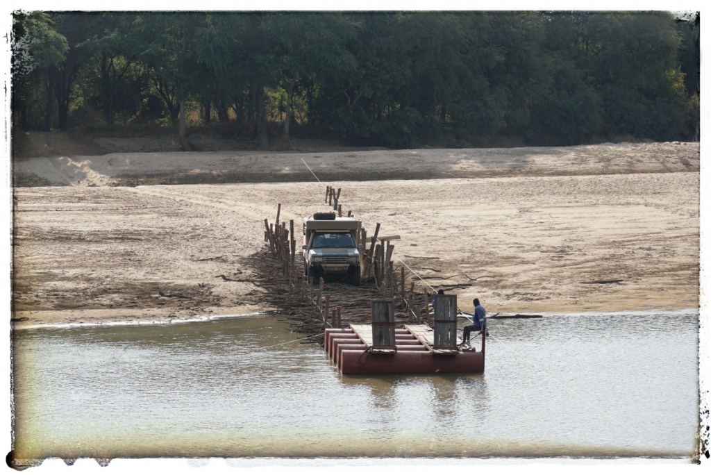 pontoon river crossing in deepest africa with a 4x4