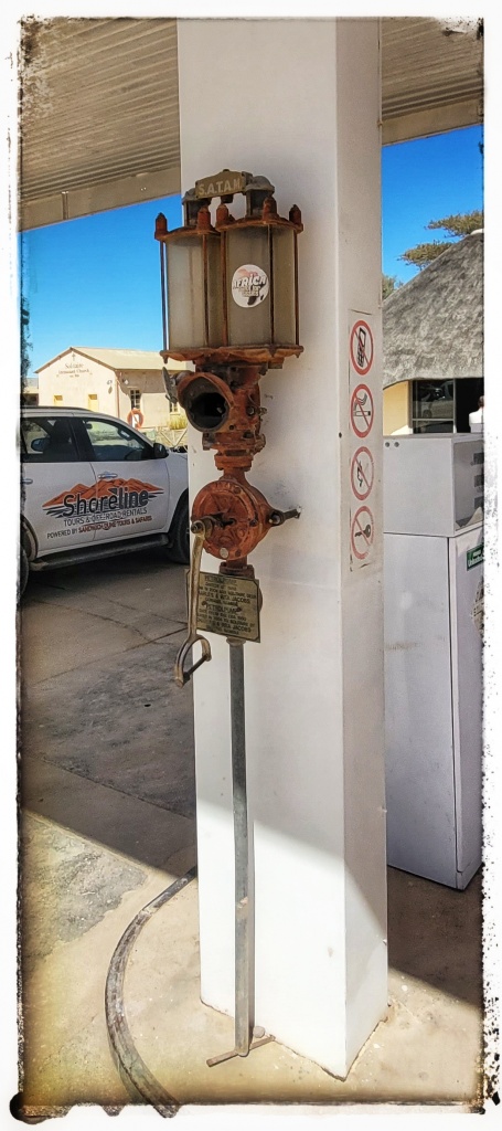 old and operated fuel pump at garage in Africa