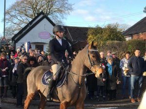 Chloe and Harold in the boxing day hunt in Woore wearing here Equestrian World of Maynooth saddle cloth.