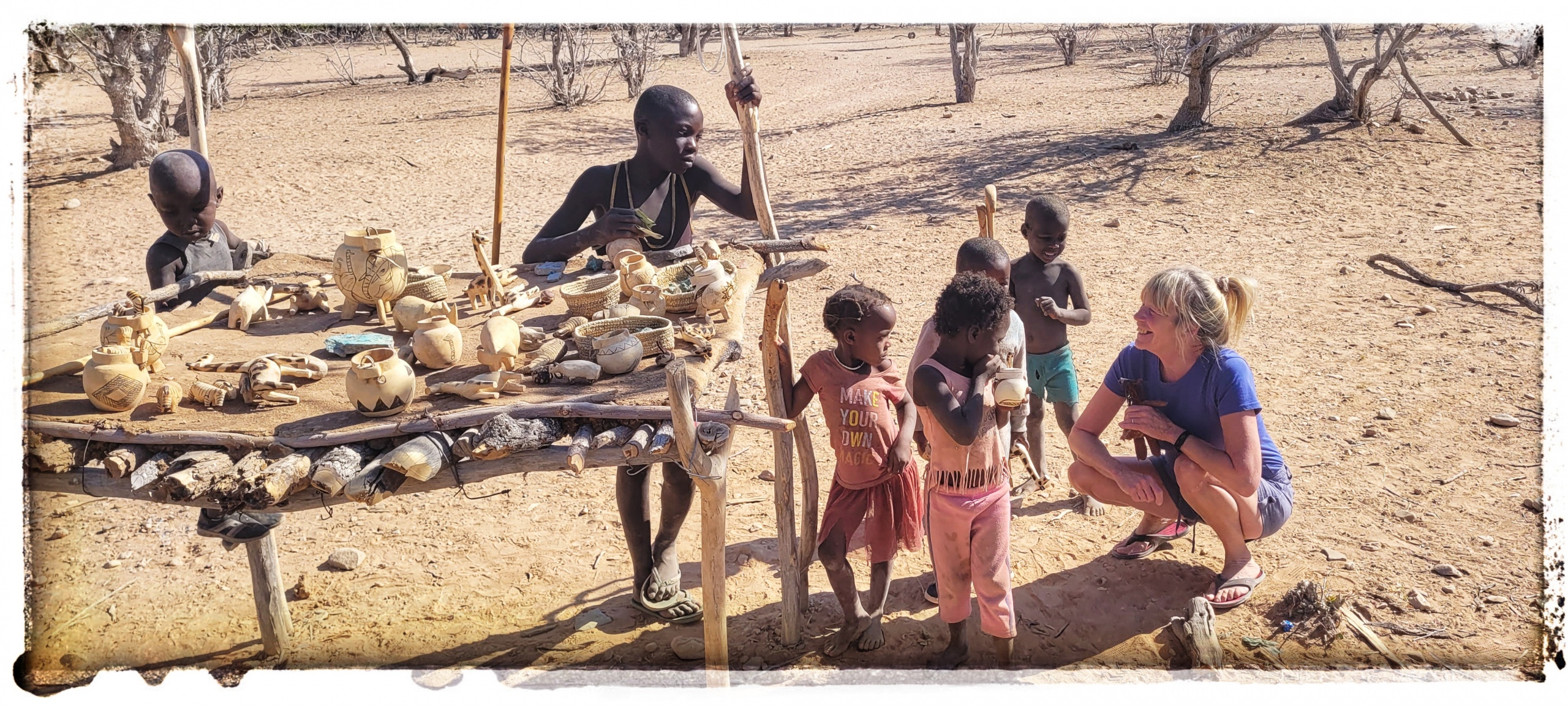 tribal children selling tourists stuff deep into the namibian desert